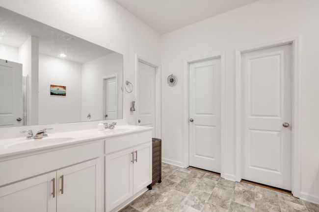 Master bath with his & her walk-in closets | Image 17