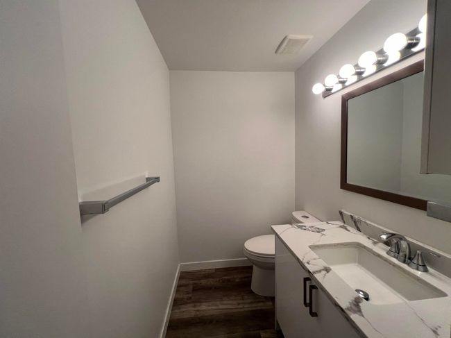 Half bath featuring wood finished floors and vanity | Image 31