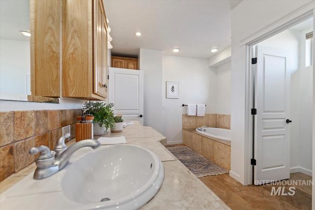 Full bath featuring a bath, recessed lighting, and double vanity | Image 32