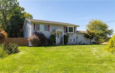 Raised ranch featuring a front yard | Image 1