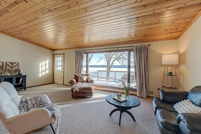 Enjoy a spacious floor plan with a living room perfectly framing stunning river views—your own private paradise! | Image 6