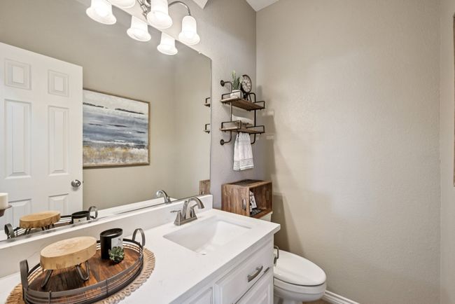 Half bathroom featuring toilet and vanity | Image 17