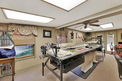 Sewing/craft/bonus room with light carpet and ceiling fan | Image 3