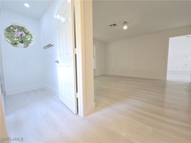 Corridor featuring light wood-style floors, baseboards, and recessed lighting | Image 26