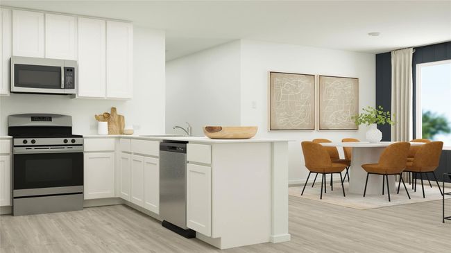Kitchen featuring stainless steel appliances, a sink, a peninsula, white cabinets, and light wood-style floors | Image 17