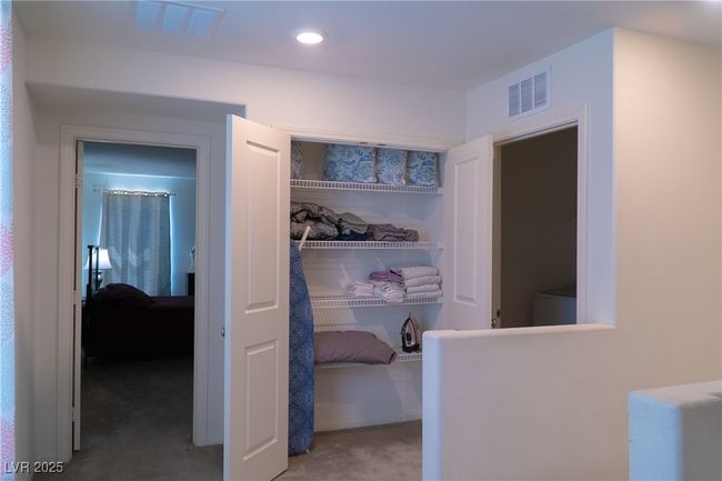 Hall with carpet and visible vents | Image 43