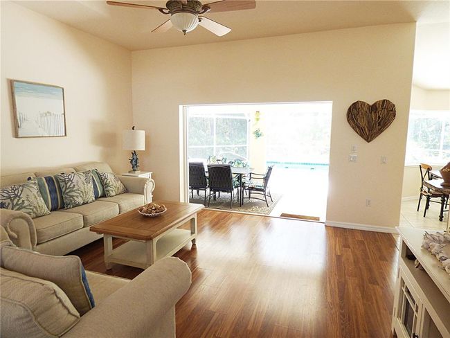 easy to maintain flooring: porch, dinette and kitchen are tiled, great room and formal dining area with great laminated flooring. | Image 13