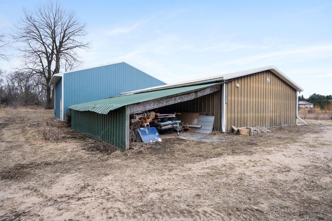 Lean-to with dirt floor for extra storage. | Image 58