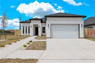 View of front facade with a garage | Image 1