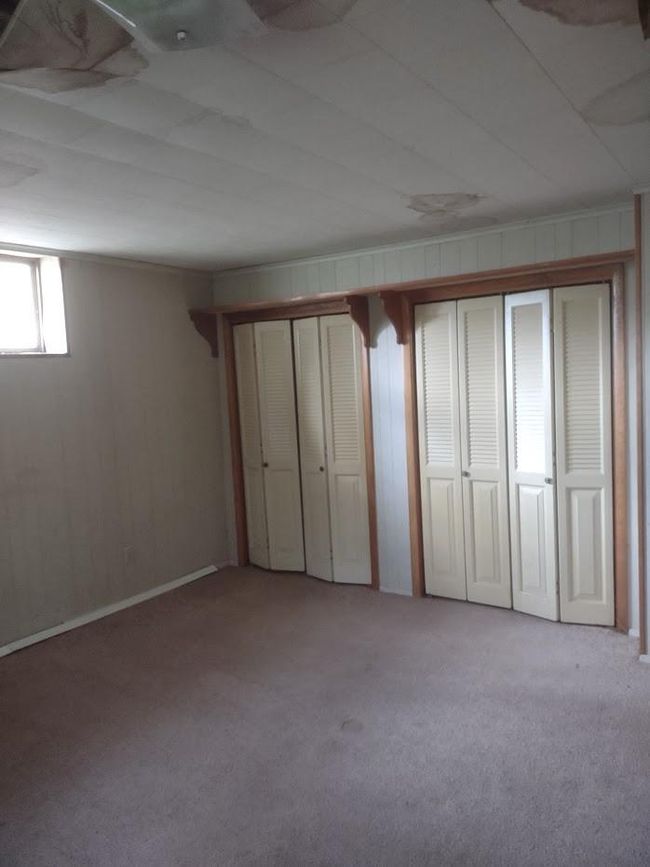 Unfurnished bedroom featuring carpet floors | Image 5