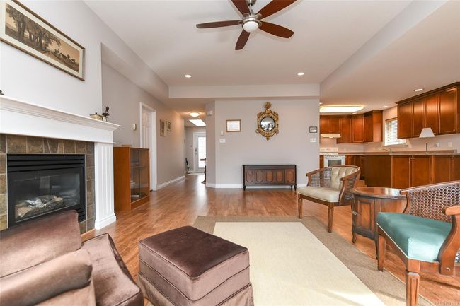 Dining room featuring baseboard heating, french doors, wood finished floors, and baseboards | Image 8