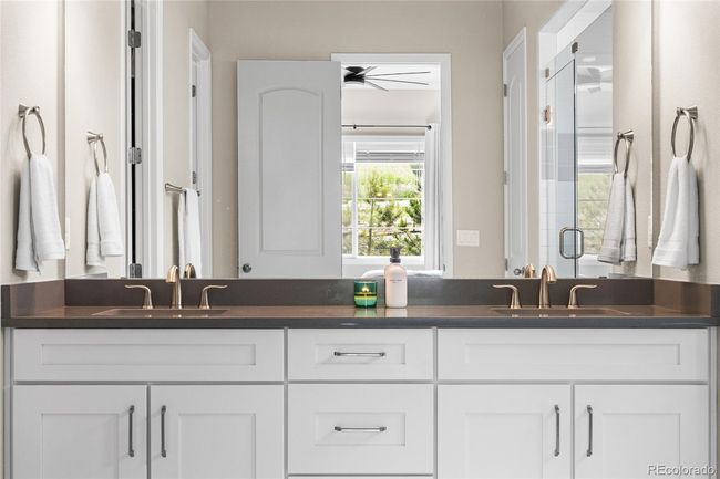 Primary spa-like ensuite with oversized shower (complete with rain shower head), linen closet and beautiful tile work. | Image 22