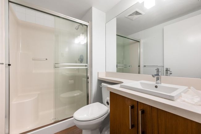 Bathroom featuring vanity and a stall shower | Image 20