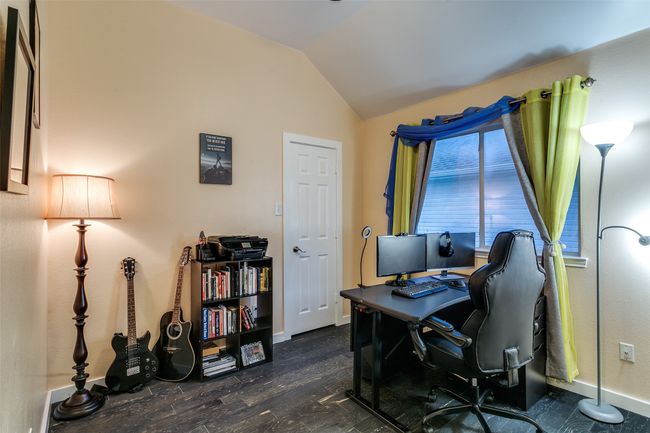 Home office with lofted ceiling, baseboards, and dark wood-style floors | Image 23