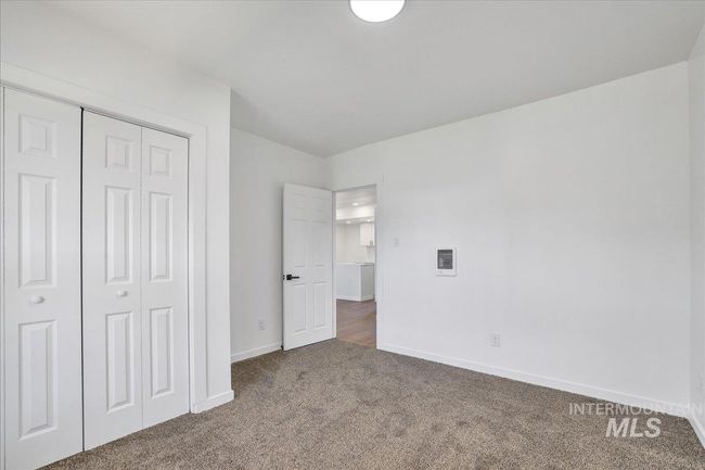 Unfurnished bedroom with carpet and a closet | Image 25