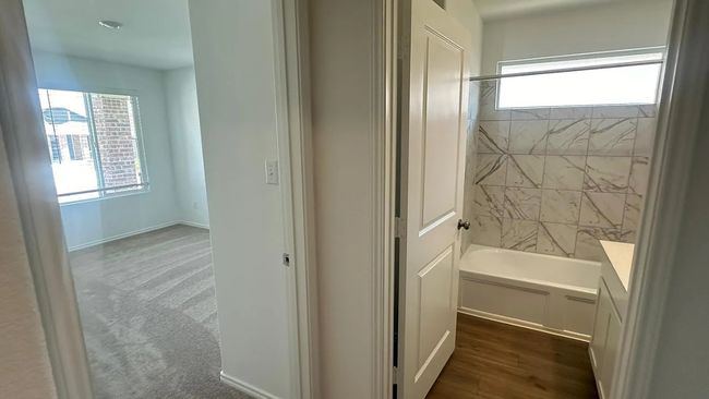 Full bathroom featuring shower / bathtub combination and baseboards | Image 30