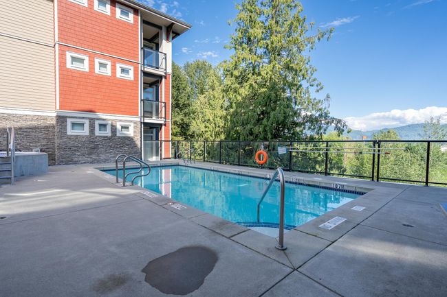 Community pool featuring a patio area and a mountain view | Image 13