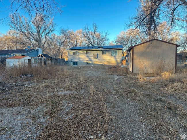 Back of property with solar panels and sheds | Image 18