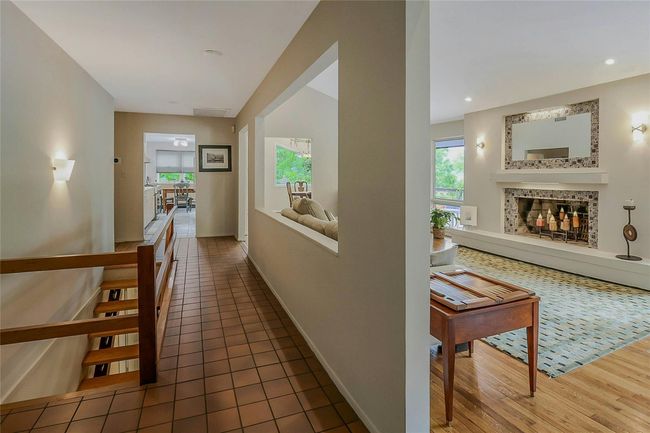 Hallway featuring healthy amount of natural light, wood finished floors, baseboards, and recessed lighting | Image 8