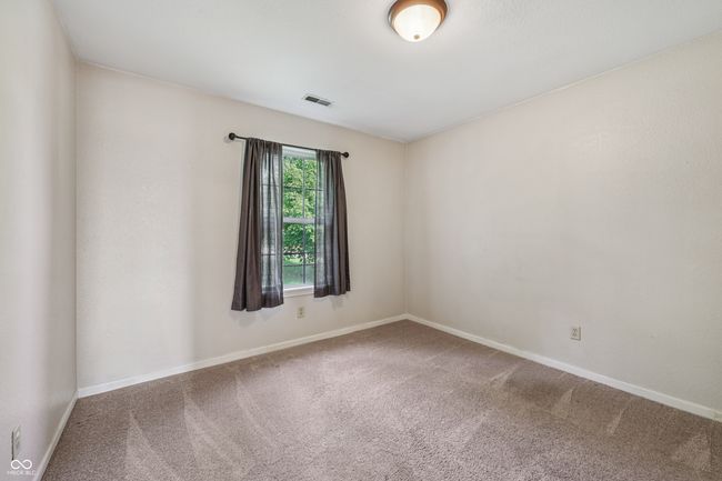 unfurnished room featuring carpet floors and baseboards | Image 22