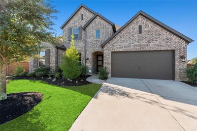 Welcome home to 7139 Button Bush Way in the highly sought after Cane Island community in Katy! | Image 1