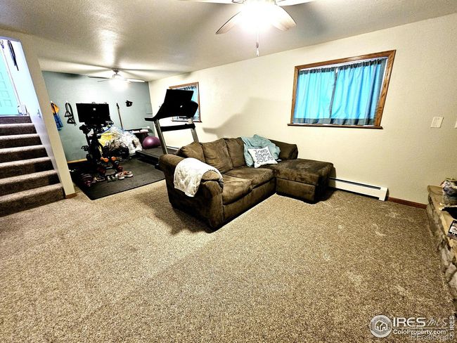 Family room with room for a workout area (main water shut off is on the E wall of the workout area) | Image 16