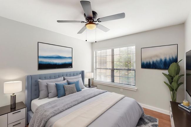 Bedroom with a ceiling fan, wood finished floors, and baseboards | Image 27