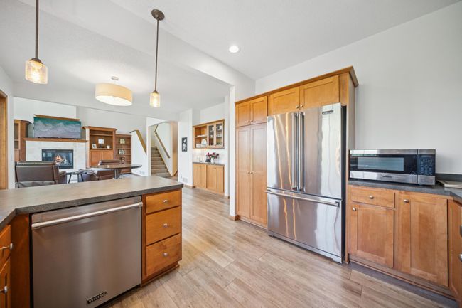 Beautiful kitchen with stainless steel appliances and a classic subway tile backsplash! | Image 13