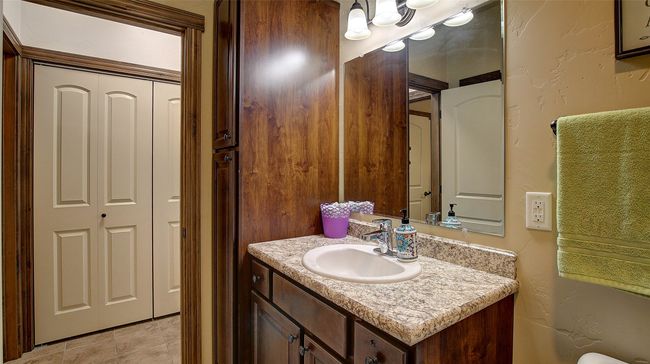 Guest Bathroom with tub/shower combo and access to the guest bedroom. Electric wall heater. | Image 26