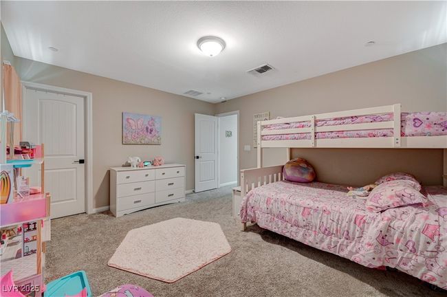 Carpeted bedroom with baseboards | Image 49