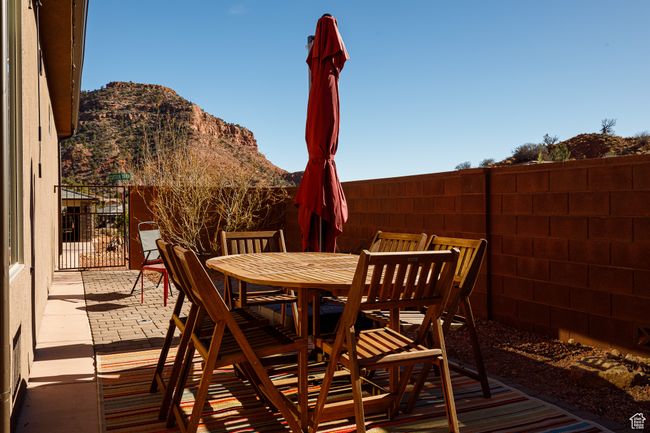 View of patio / terrace with outdoor dining space, fence, and a mountain view | Image 15