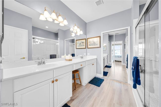 Ensuite bathroom featuring Double sinks, Walk in Closet, Glass Shower door | Image 13