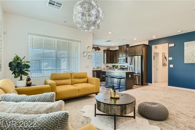 Living room featuring recessed lighting, a chandelier, visible vents, light carpet, and baseboards | Image 16