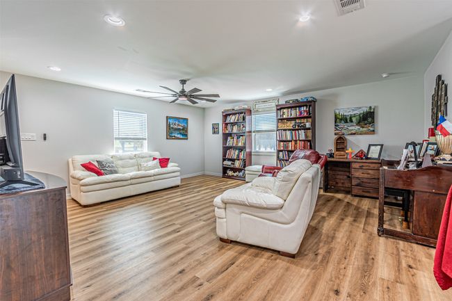Living area featuring light wood finished floors, recessed lighting, and a ceiling fan | Image 6