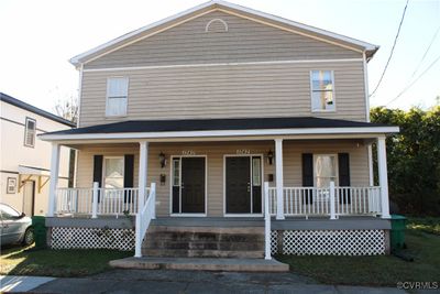 View of front facade featuring a porch | Image 1