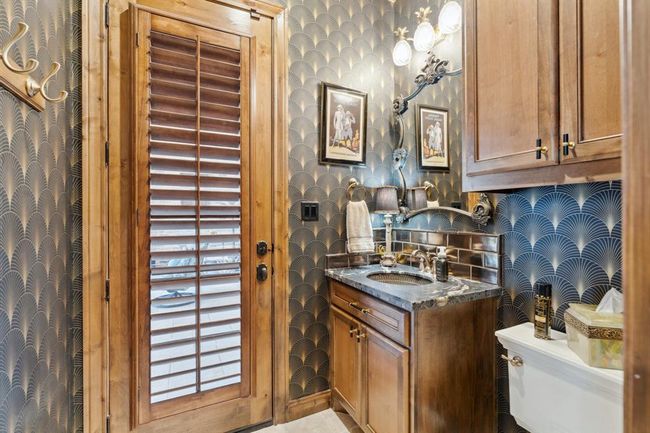 The Media/Pool Bathis convenientlylocated between theMedia Room and theoutside covered patioand pool deck. Beautifully detailed! | Image 18