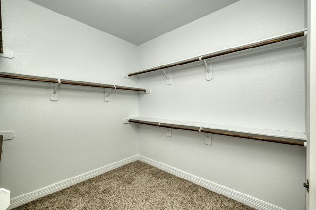 Primary bedroom large walk in closet | Image 15