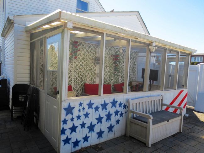 View of patio with a sunroom | Image 29