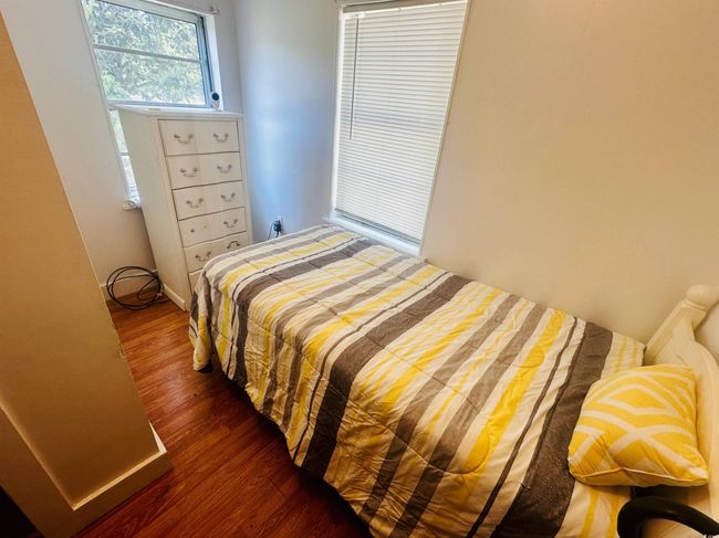 Bedroom featuring wood finished floors | Image 10