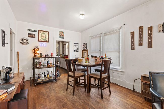 Dining room featuring dark wood-style floors and baseboards | Image 5
