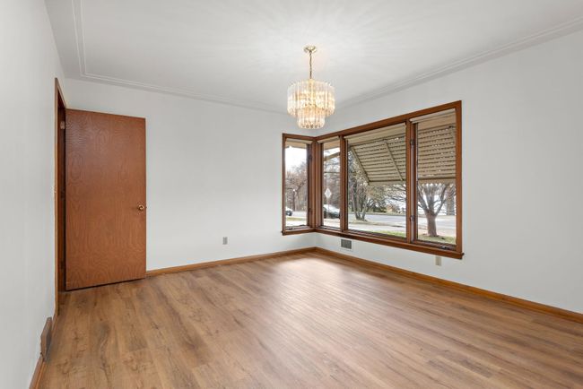 Main Floor Formal Dining Room with lots of windows to capture the Lake and Sunset views! | Image 47