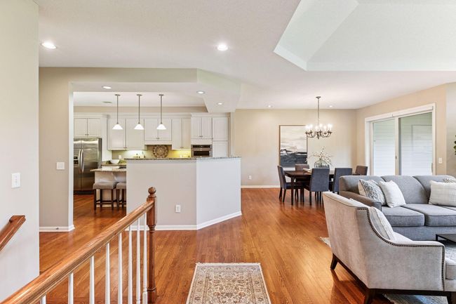 Gleaming hardwood floors flow effortlessly across the main level. | Image 6