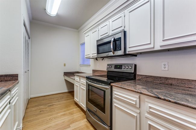 Another view of the galley kitchen | Image 19
