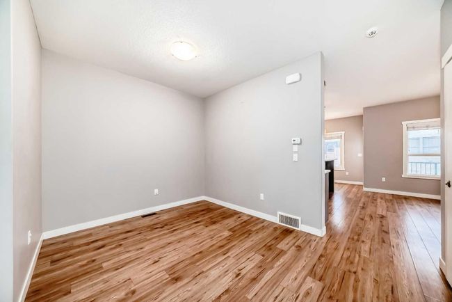23 Baysprings Way Sw, Home with 3 bedrooms, 3 bathrooms and 1 parking in Airdrie AB | Image 6