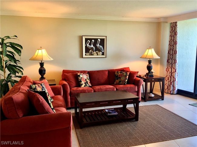 Tiled living room featuring crown molding | Image 8