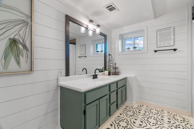 Bathroom featuring vanity, wood walls, and tile patterned flooring | Image 35