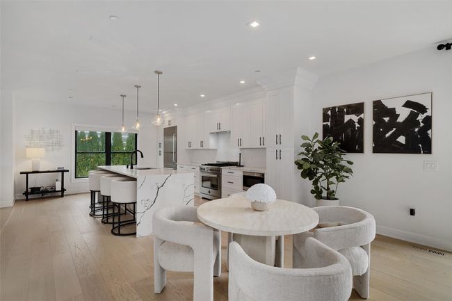 Dining space with baseboards, light wood-style floors, visible vents, and recessed lighting | Image 9