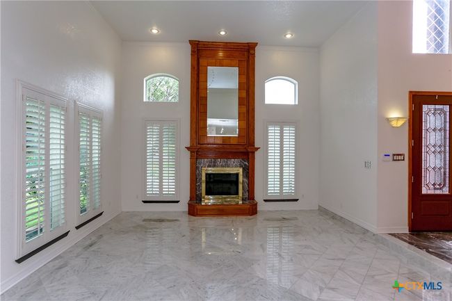 Ceiling to floor wood fireplace | Image 11