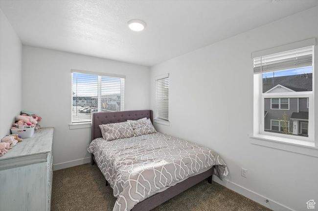 Carpeted bedroom featuring baseboards | Image 14