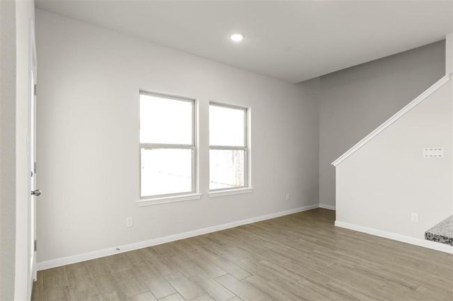 Empty room featuring baseboards, recessed lighting, and light wood-style floors | Image 8